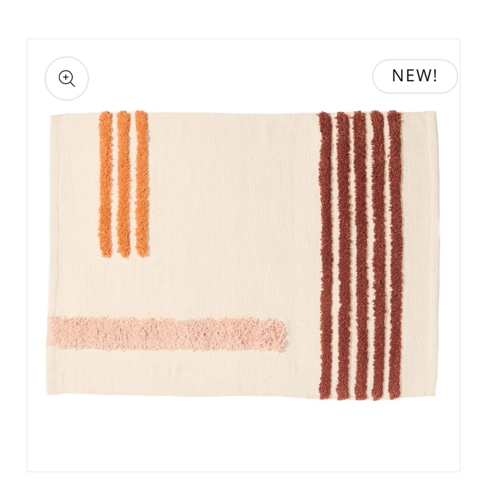Quiet Town Cream Bath Mat with Orange and Brown Stripes